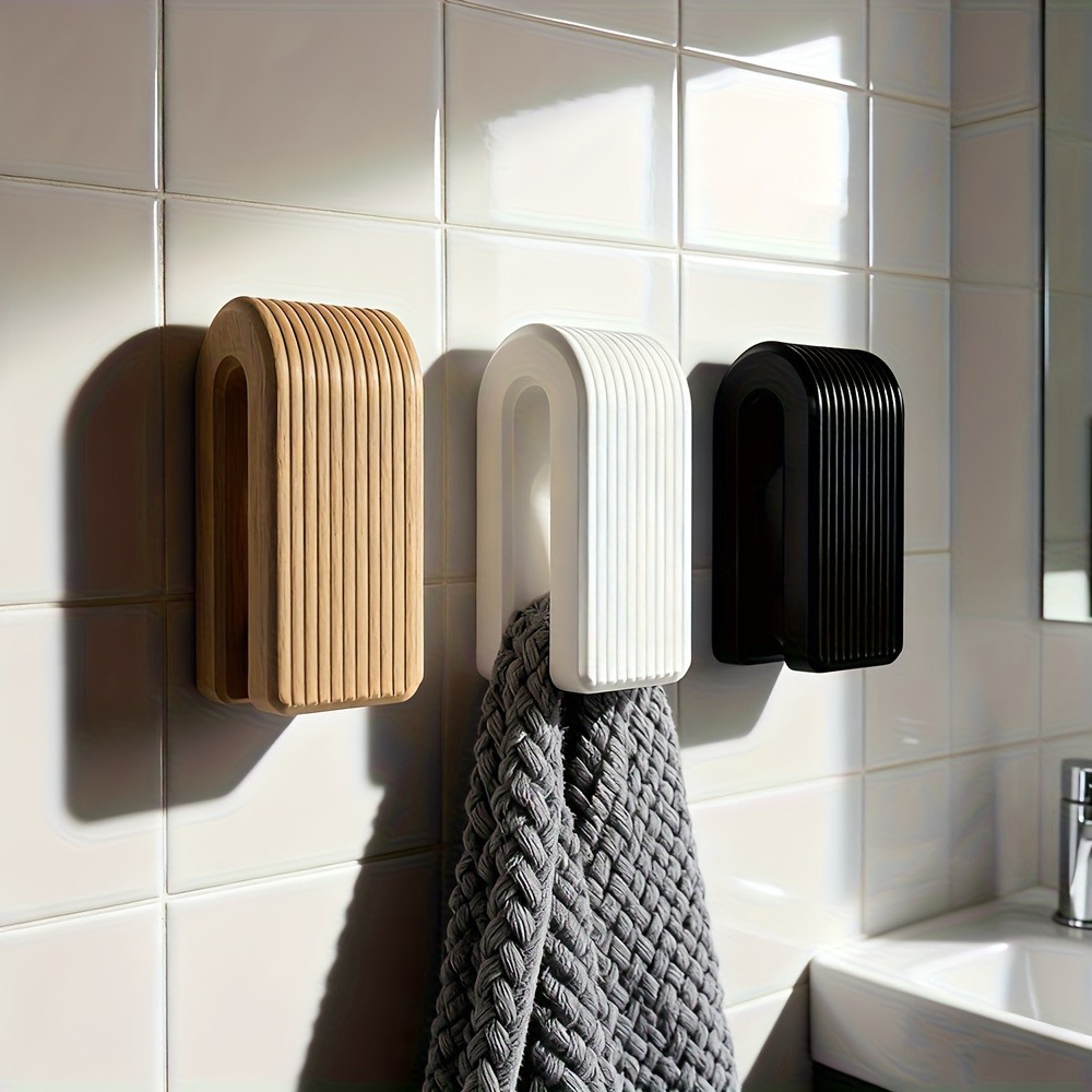 Three ribbed holder colours shown in a bathroom scene with a grey towel.
